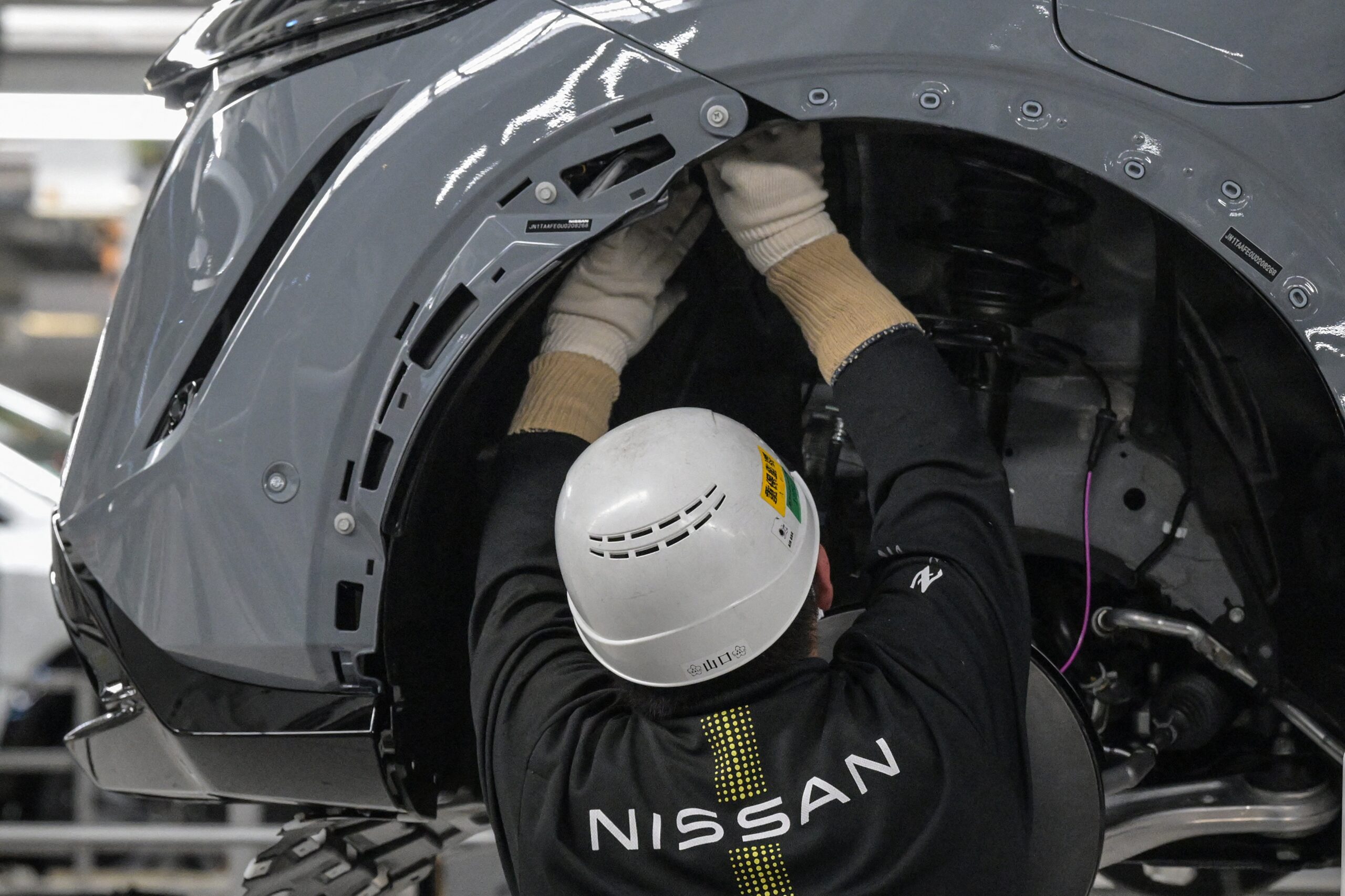 Technicus aan het werk in de Nissan Motor Tochigi fabriek, de grootste fabriek van Nissan in Japan. - Foto: 
Richard A. Brooks / AFP