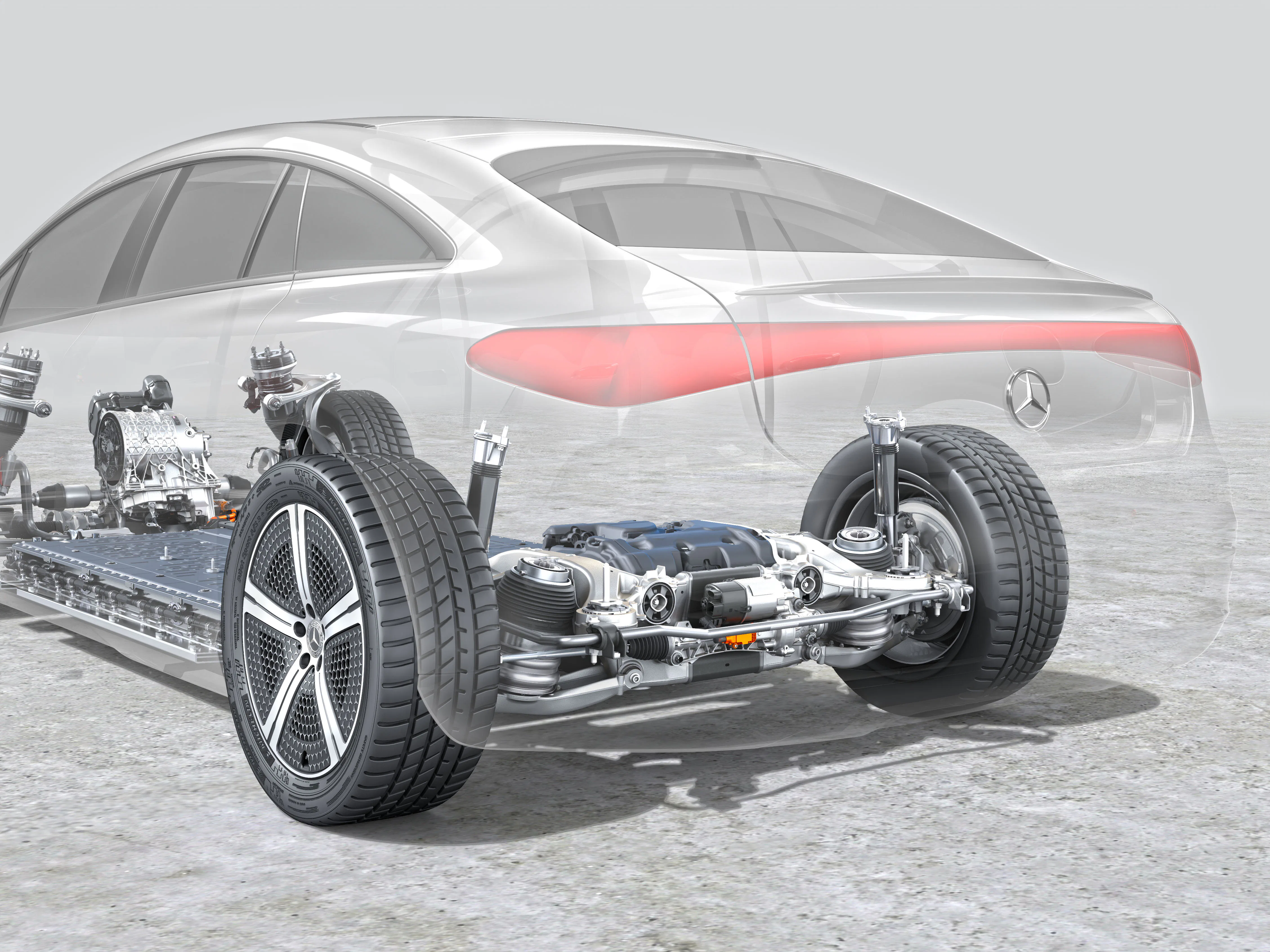 Volledig steer-by-wire als EQS primeur, maar de achteras besturing was eigenlijk al lang ‘by-wire’. Zie de stuurmotor middenin, boven de oranje stekker. - Foto: Mercedes-Benz